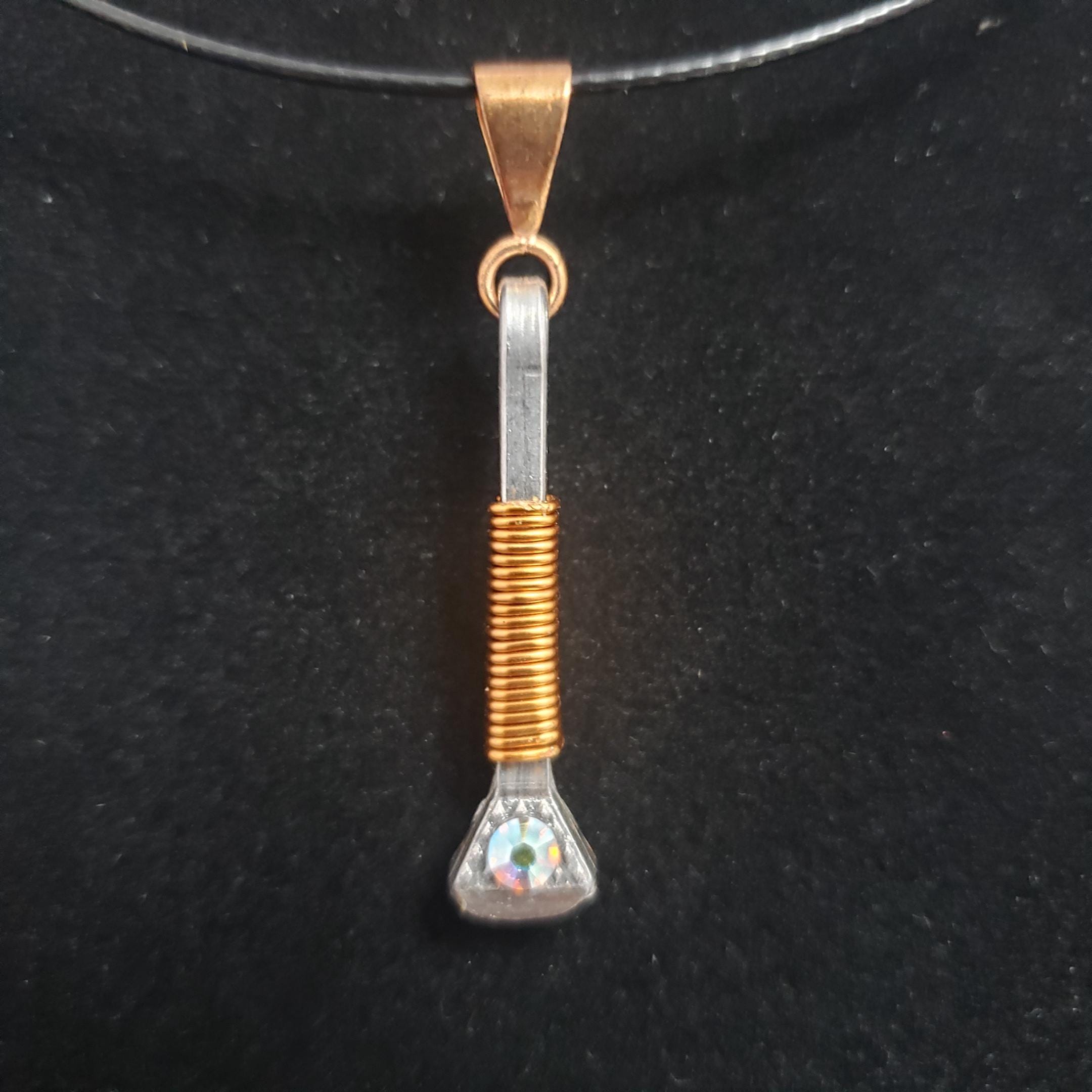 Horseshoe nail pendant - wire wrapped