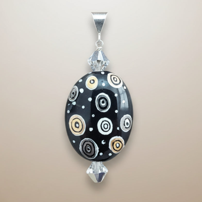 Hand-painted porcelain pendant w/ Swarovski crystals and sterling silver bail.